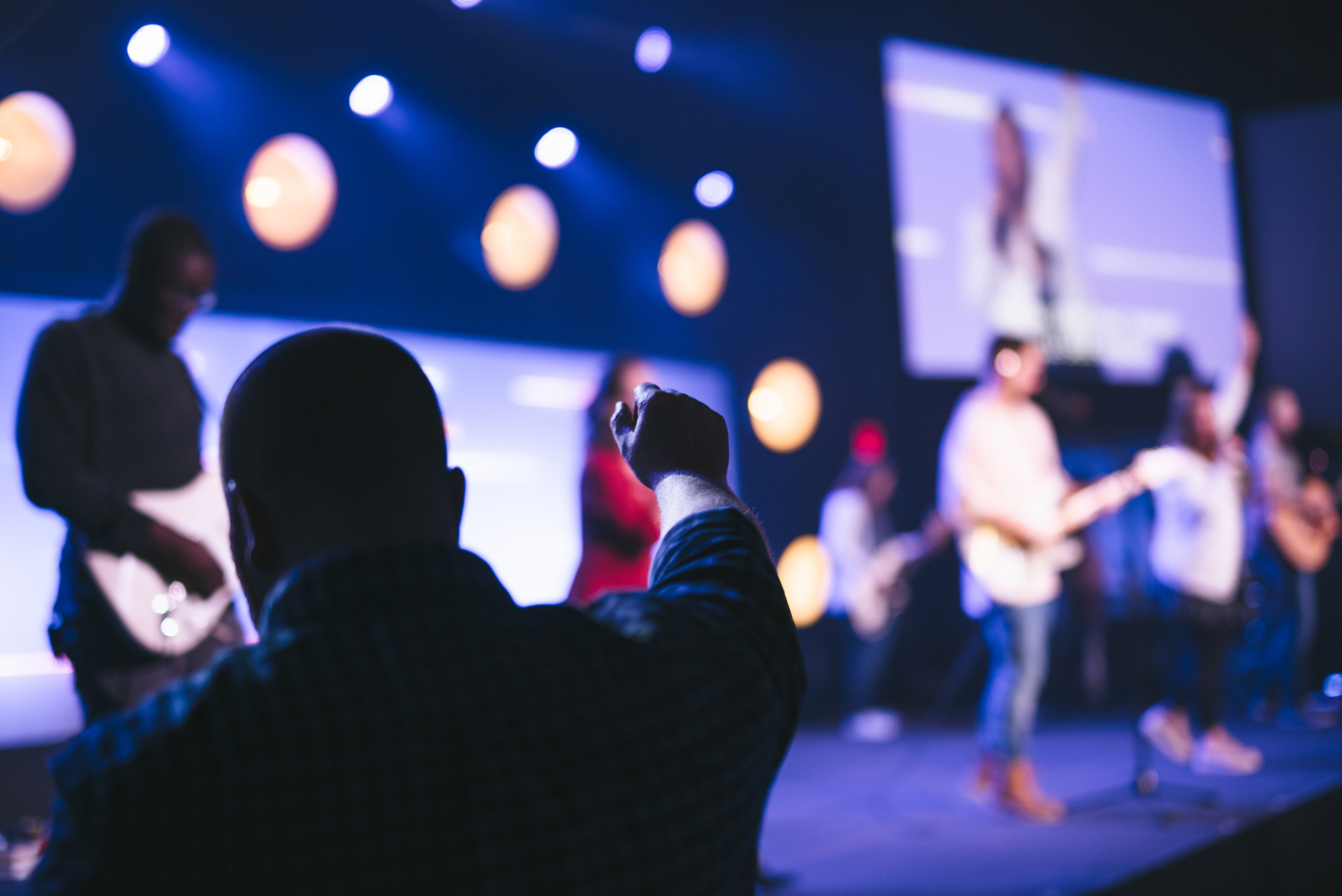 Congregation worshipping with the band on stage